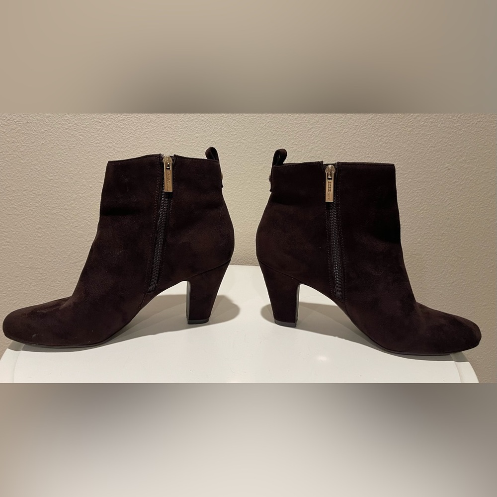 Spring chic awaits! BCBG’s Brown Booties with Plush suede & gold zippers